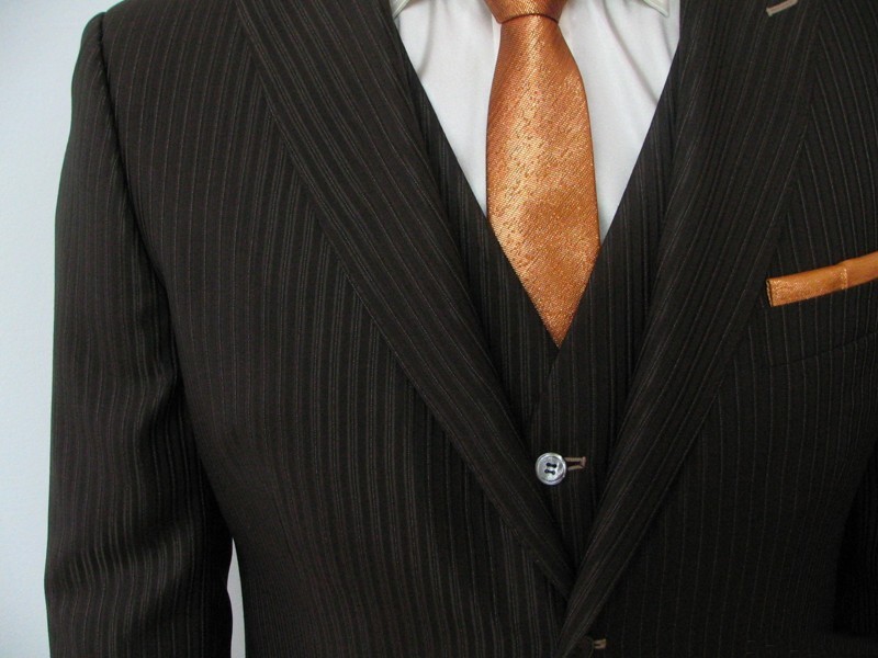 8-20: groom suit in dark brown wool-silken satin with with brown slots